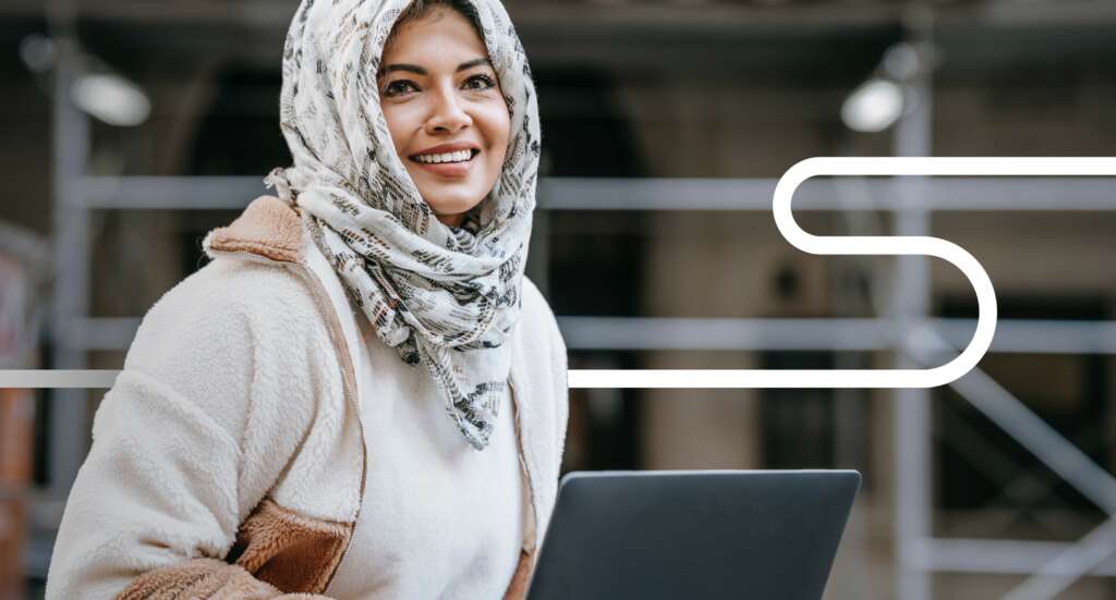 Hireguide brand image of a woman working on her lap top.